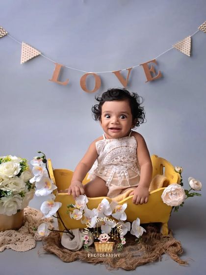 This little one is full of expression. Sitter sessions are all about capturing that emerging personality, from big smiles to curious looks.