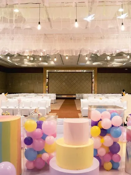 The unicorn party venue before guests arrive, showing the empty hall transformed into a magical space.