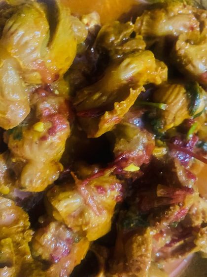A close-up of the spicy chicken gizzard, showing the rich color from the spices.