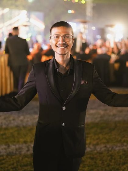 Welcoming guests to an evening of wonder. As a roaming magician, I move through the event, ensuring everyone gets to experience a personal touch of magic.