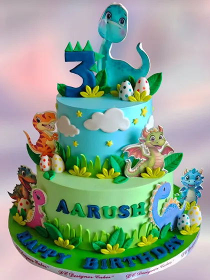 A grand two-tier dinosaur cake for a third birthday. This cake is bustling with various dinosaur figures, creating a lively and exciting scene for a young dinosaur enthusiast.