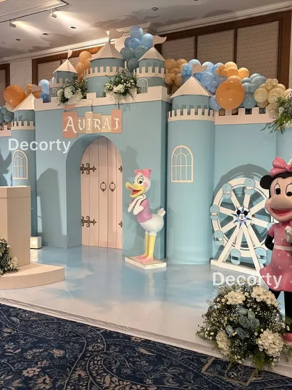 A closer view of the castle stage, highlighting the details like the ferris wheel, Daisy Duck, and Minnie Mouse cutouts.