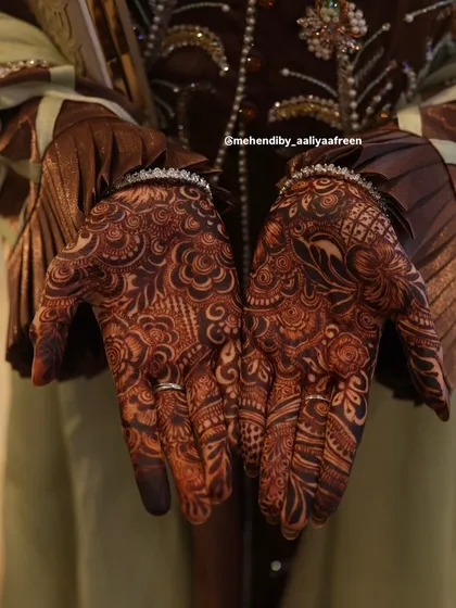 Another professional photo showing the beautiful, rich color of the full bridal henna design.