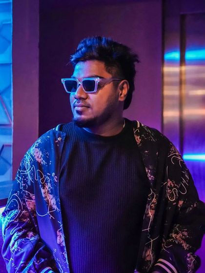 A posed shot in the club before a set. The cool blue and purple lighting sets the mood for the night ahead.