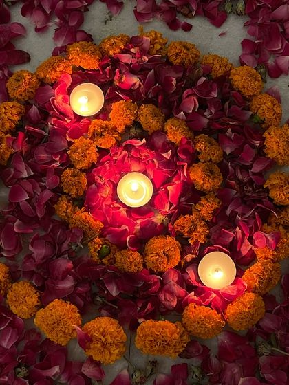 A beautiful mandala of marigolds and rose petals with candles, created to hold the center of our meditation circle and focus our collective energy.