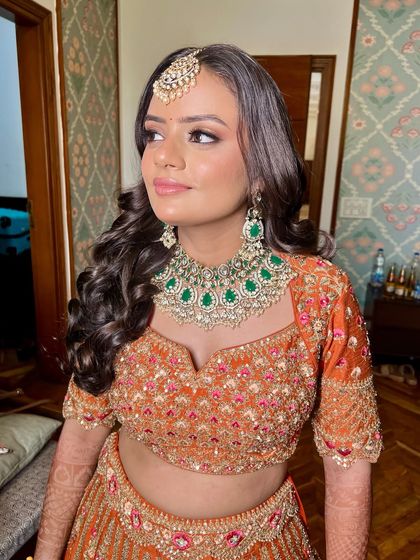 The side profile shows how the soft curls and makeup come together. My goal is always to make sure my brides look beautiful from every single angle.