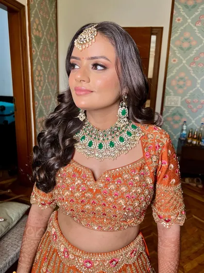 The side profile shows how the soft curls and makeup come together. My goal is always to make sure my brides look beautiful from every single angle.