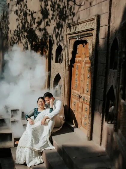 We added a touch of smoke to create a dreamy, cinematic atmosphere for this romantic shot. This technique enhances the mood and adds a magical quality to our heritage photoshoots.