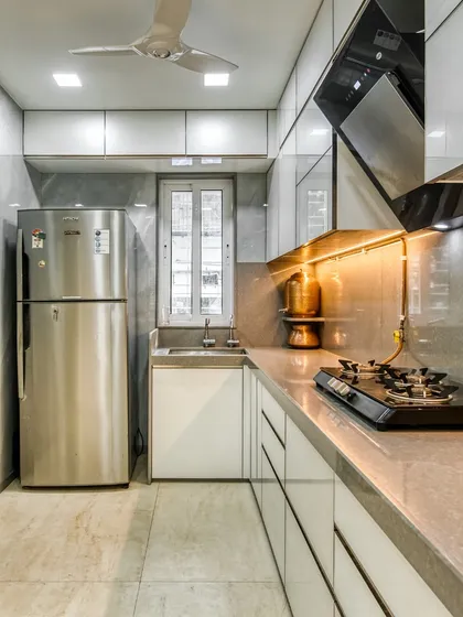 We create modern kitchens that look great and work efficiently, tailored to your needs. This image showcases a compact yet stylish design, perfect for urban living.