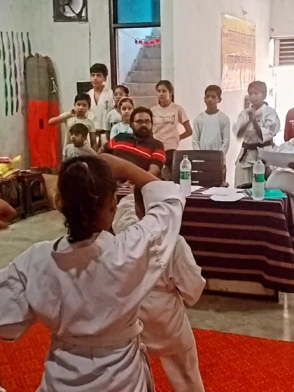 A student performs her techniques in front of the panel. This is her moment to shine.