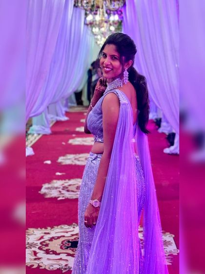 This enchanting grey fairytale lehenga is designed to make dreams come true. The shimmering sequin fabric catches the light beautifully, and the attached cape-like dupatta adds a touch of modern drama.