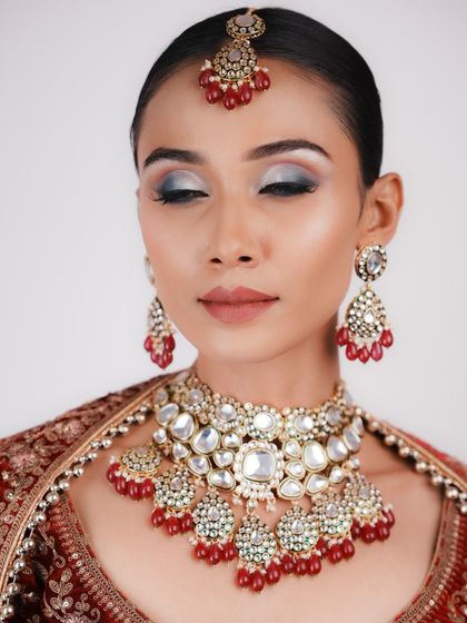 The closed-eye shot of the airbrush makeup showcases the smooth gradient and intense pigmentation that can be achieved, a skill you'll learn in my advanced classes.