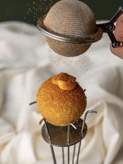 Taking the humble potato to a new level. This is a Parma Ham & Potato Croquette, dusted with chorizo and bacon dust and served with a caccio e pepe aioli.