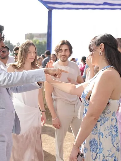 Engaging directly with a guest during an interactive piece. My goal is to make everyone feel involved, breaking the ice and creating a fun, relaxed atmosphere at weddings.