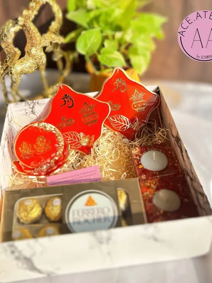 The vibrant red version of my festive hamper, perfect for adding a pop of color to Diwali celebrations. Each item, from the standee to the hangings, is handcrafted with intricate detail.