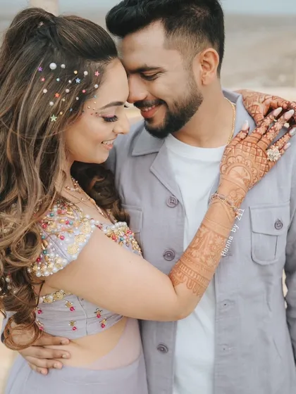 A beautiful couple shot where you can see the amazing henna stain. It looks so rich and complements the bride's outfit perfectly.