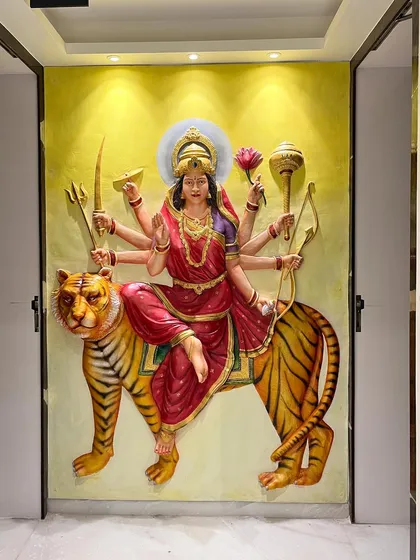 Creating spiritual art is a deeply personal process. This powerful 3D fiber mural of Maa Durga was sculpted and painted to bring divine energy and strength into the space.