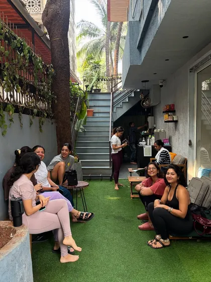 The connection doesn't end on the mat. Our outdoor space is perfect for unwinding, sharing stories, and making new friends after a class.
