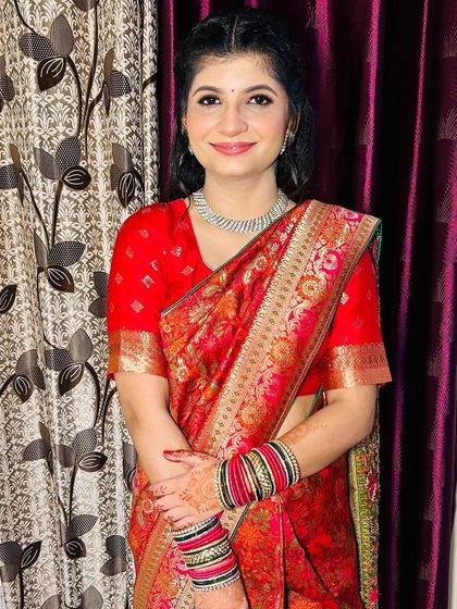 A smiling portrait of the Roka bride, exuding happiness.