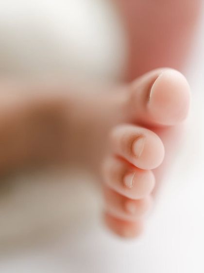 A macro shot focusing on perfect little toes.