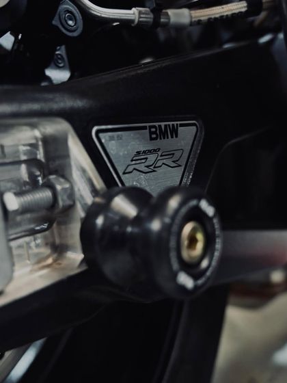 The BMW S1000RR chassis plate and swingarm spool.