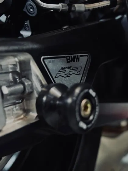 The BMW S1000RR chassis plate and swingarm spool.