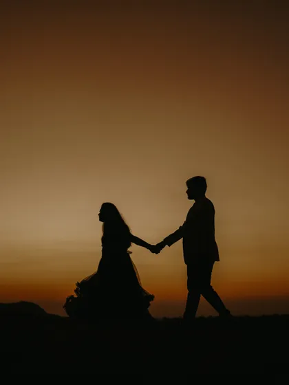 A beautiful pre-wedding silhouette that captures the couple's connection against a stunning sunset backdrop.