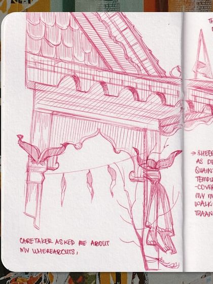 Another spread showing the variety in my sketchbook. A detailed architectural sketch in pink sits next to a colorful character and some abstract lettering.