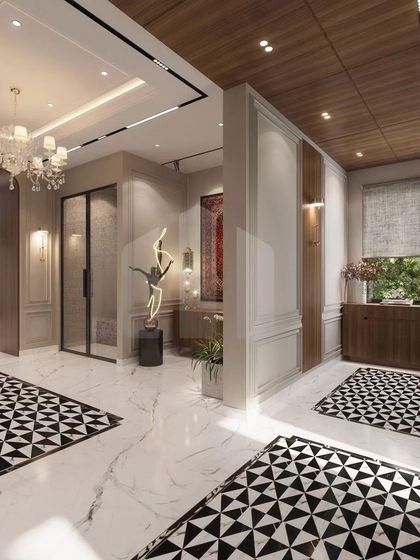 A perfect entrance sets the tone for the entire home. For this luxury residence in Bihar, we used bold geometric floor tiles, classical wall paneling, and a striking sculpture to create a grand and welcoming foyer that makes an immediate statement of elegance.