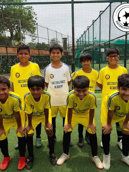 Our U-12 team in their bright yellow jerseys, posing for a photo after a thrilling win in a YPL match. Their smiles show the joy of teamwork and victory.