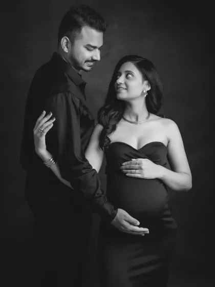 The look you share speaks volumes. This monochrome portrait captures a candid moment of love and admiration between you, making it a timeless keepsake.