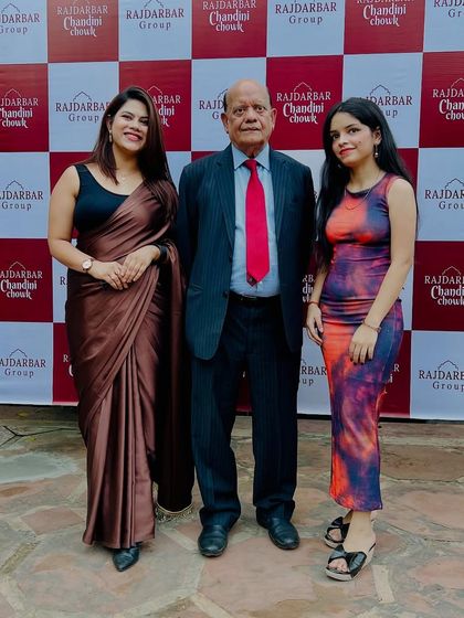 Posing with esteemed guests at the Rajdarbar Group event. It's an honor to share the stage with industry leaders.