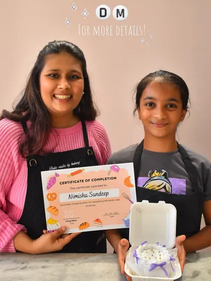 A student proudly holds up her certificate and her beautifully decorated bento cake. In my classes, every child leaves with a sense of accomplishment and a tasty treat.