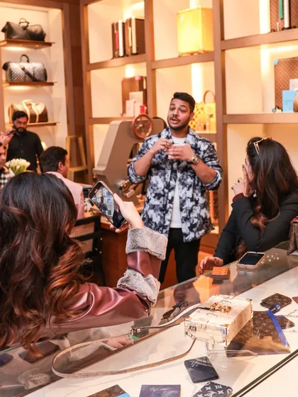Performing for guests at the Louis Vuitton counter. My magic is designed to feel exclusive and personal, making it a perfect fit for luxury retail environments.