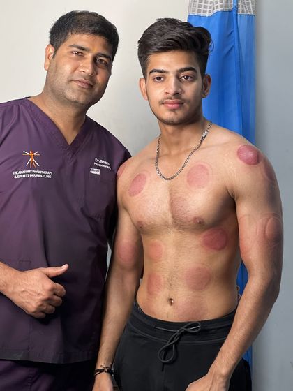 With a young client after his cupping session.