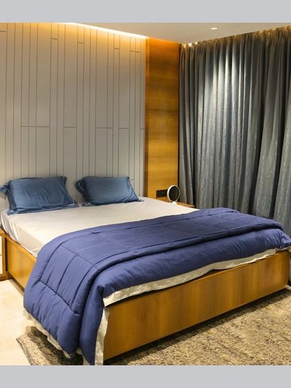 A comparison of the initial 3D render and the final built bedroom. This showcases our ability to translate a design concept into a tangible space, matching the textures, colors, and lighting as envisioned.