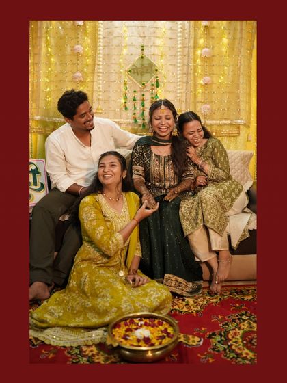 The Mehendi ceremony is a celebration with everyone you love. Here, the bride is surrounded by her closest friends and family, sharing stories and laughter. I make sure to capture these group dynamics and candid moments.