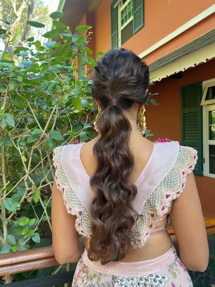 A beautiful textured ponytail, perfect for a glamorous evening look.