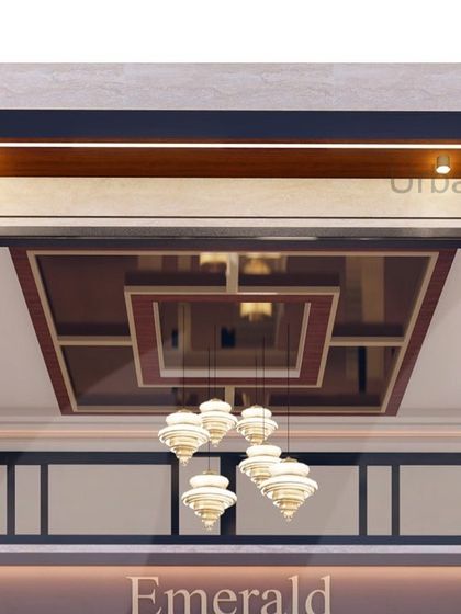 A close-up of the magnificent chandelier and coffered ceiling designed for the Emerald luxury apartment tower. This element adds a sense of grandeur and serves as a central design feature in the double-height foyer.