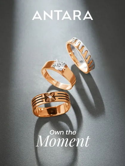 This image showcases the variety within my men's ring collection. It features a solitaire diamond ring, a modern two-tone band, and a geometric design with black enamel detailing, all crafted in rose gold.