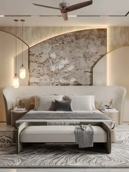 We designed this master suite as a sanctuary of calm. The bespoke, curved headboard features an inset of handpainted wallpaper, complemented by soft, layered textiles and a plush rug over white flooring to create a tranquil and sophisticated retreat.