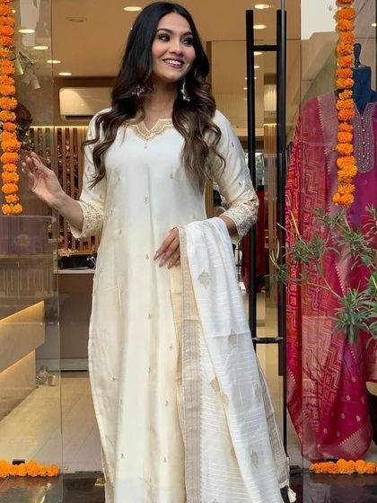 This cream viscose chanderi kurta set is pure elegance. The subtle gold detailing and classic silhouette make it perfect for a puja or family function.