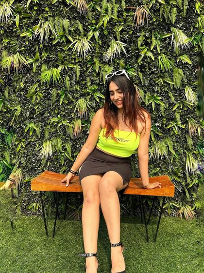 A bold and fun party look with a neon green top and a black mini skirt. This outfit is perfect for a night of dancing.