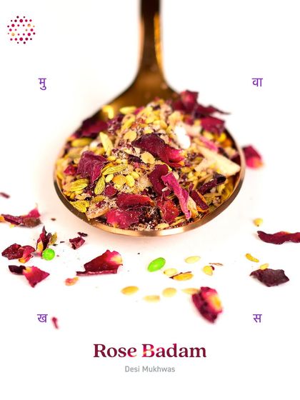 A spoonful of my Rose Badam Mukhwas, highlighting the vibrant colours and textures of the all-natural ingredients. It's a refreshing and rejuvenating blend of fragrant rose, crunchy almonds, and digestive spices.