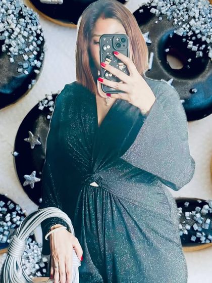 A 'no face' aesthetic shot where my glittery black jumpsuit is inspired by glazed donuts. This type of editorial content focuses on the textures and mood of the outfit, matching it to a theme.