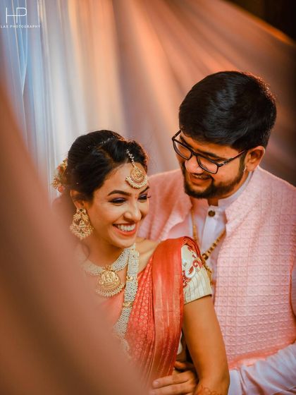 A candid, happy moment between a couple during their engagement ceremony.