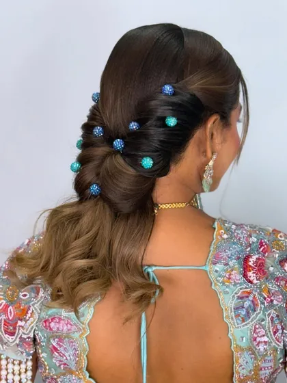 A side view of the twisted ponytail, showing how the beaded pins are placed.