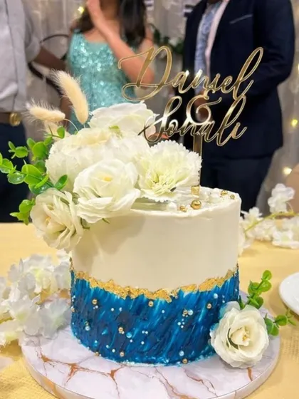 A client's photo of their engagement cake. It's wonderful to see my creation as part of their celebration.