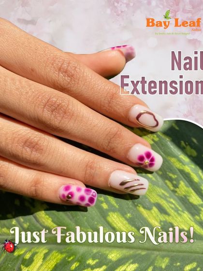 Just fabulous nails. This fun and funky nail extension set features a mix of pink polka dots, floral art, and abstract brown lines for a truly one-of-a-kind style.