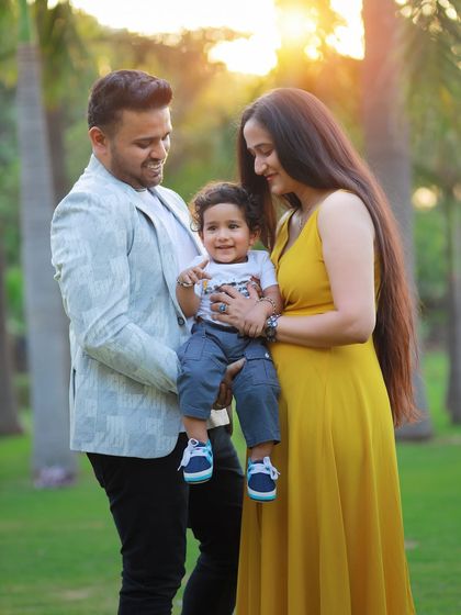 A candid family portrait taken during a first birthday photoshoot. We encourage natural interactions to capture the genuine love and happiness you share as a family.